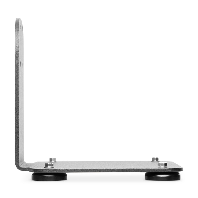 The SteadyMag™ Magnetic Mounting System is a minimalist, industrial L-shaped metal bracket with four round black rubber feet and visible bolts, shown on a white background.