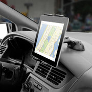 An iPad displaying a New York City map is mounted on a car dashboard with the Sticky Suction Windshield or Dash Slim-Grip® Tablet Mount, securely positioned for drivers to view navigation easily while on the go.