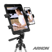 The TW Broadcaster Slim-Grip® Tablet and RoadVise® Tripod Mount Holder for Streaming Live Video securely holds a tablet and smartphone side by side—perfect for dual live streaming or content creators. The Arkon logo is shown in the corner.