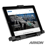 A black LockVise™ Metal Locking Tablet Holder for iPads, Galaxy Tab, and LG G Pad models displays a tablet with a mounts and accessories website. The holder and tablet are angled right; ARKON logo is in the bottom right.